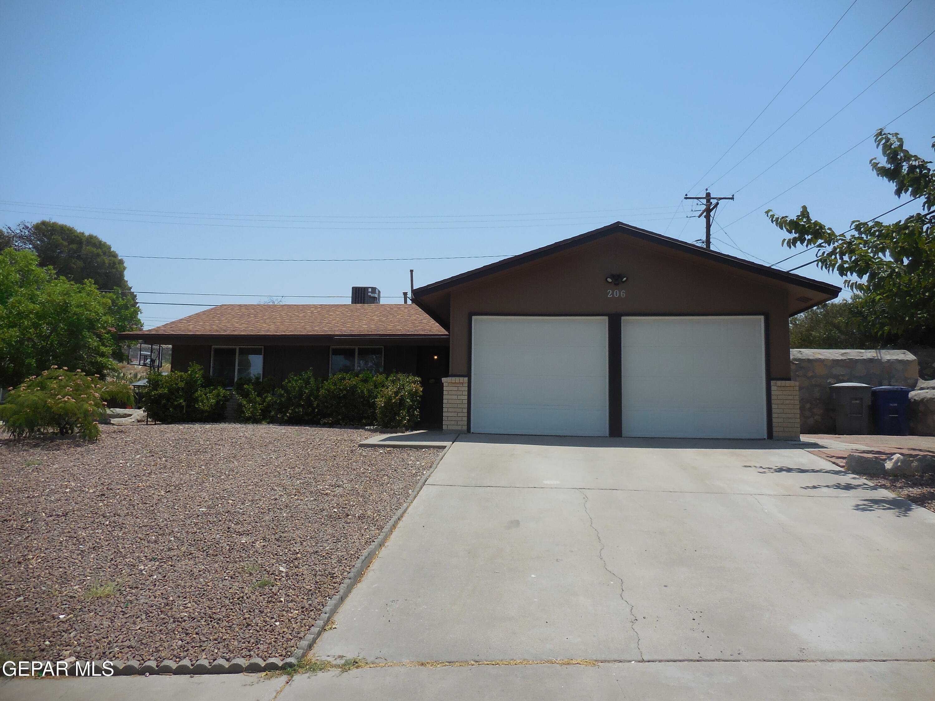 a front view of a house with yard