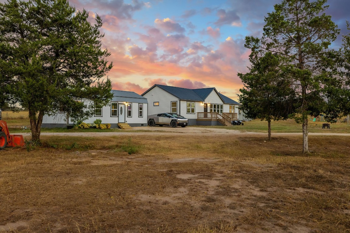 a house with trees in the background