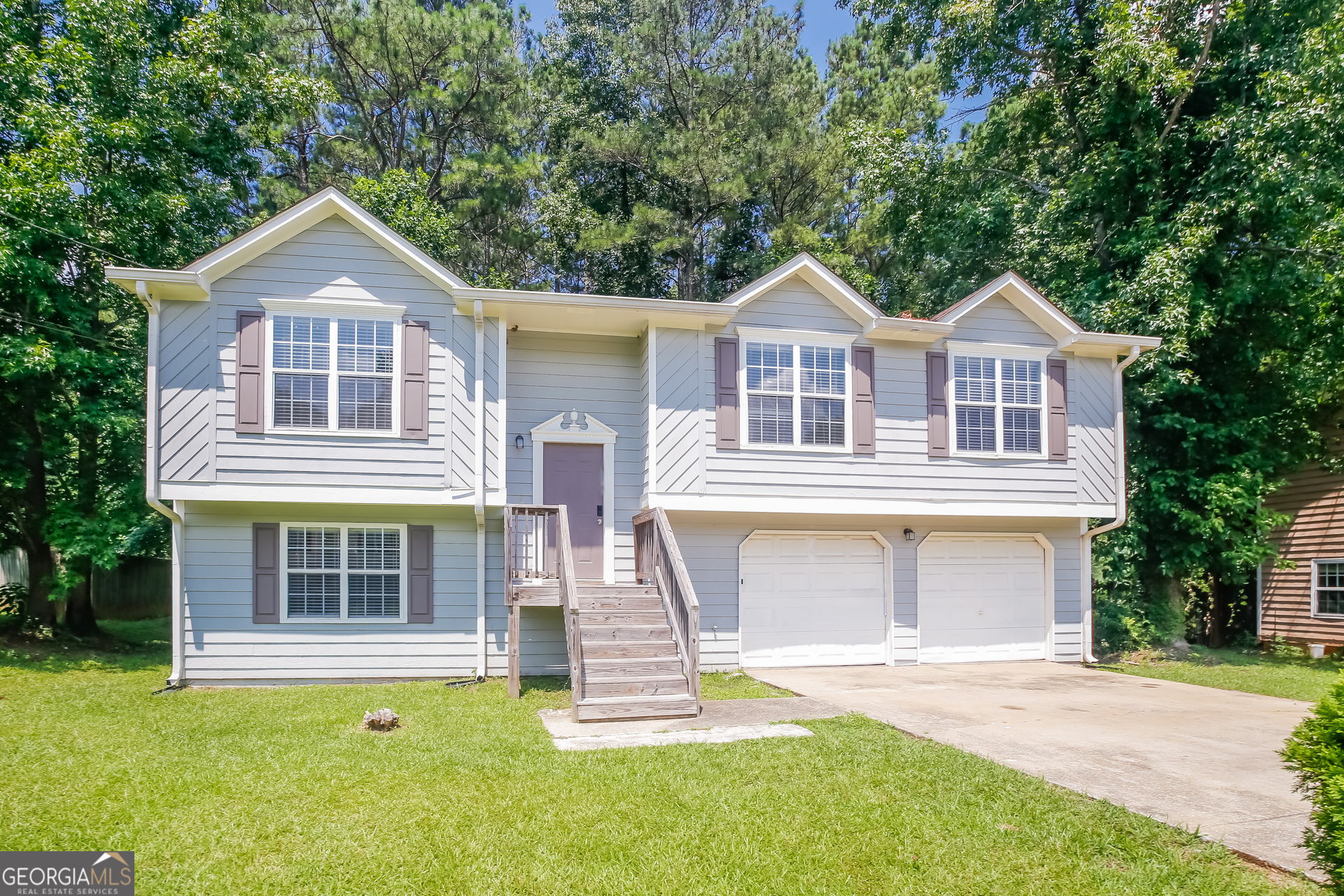 front view of a house with a yard