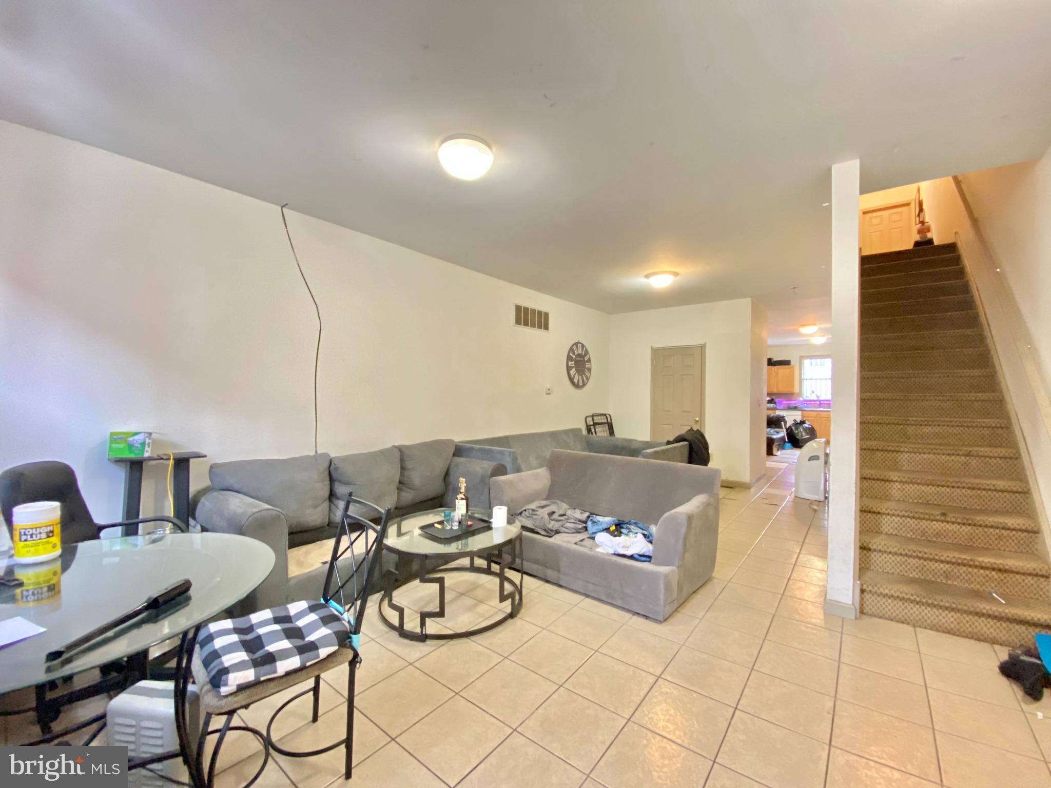 a living room with furniture and a couch