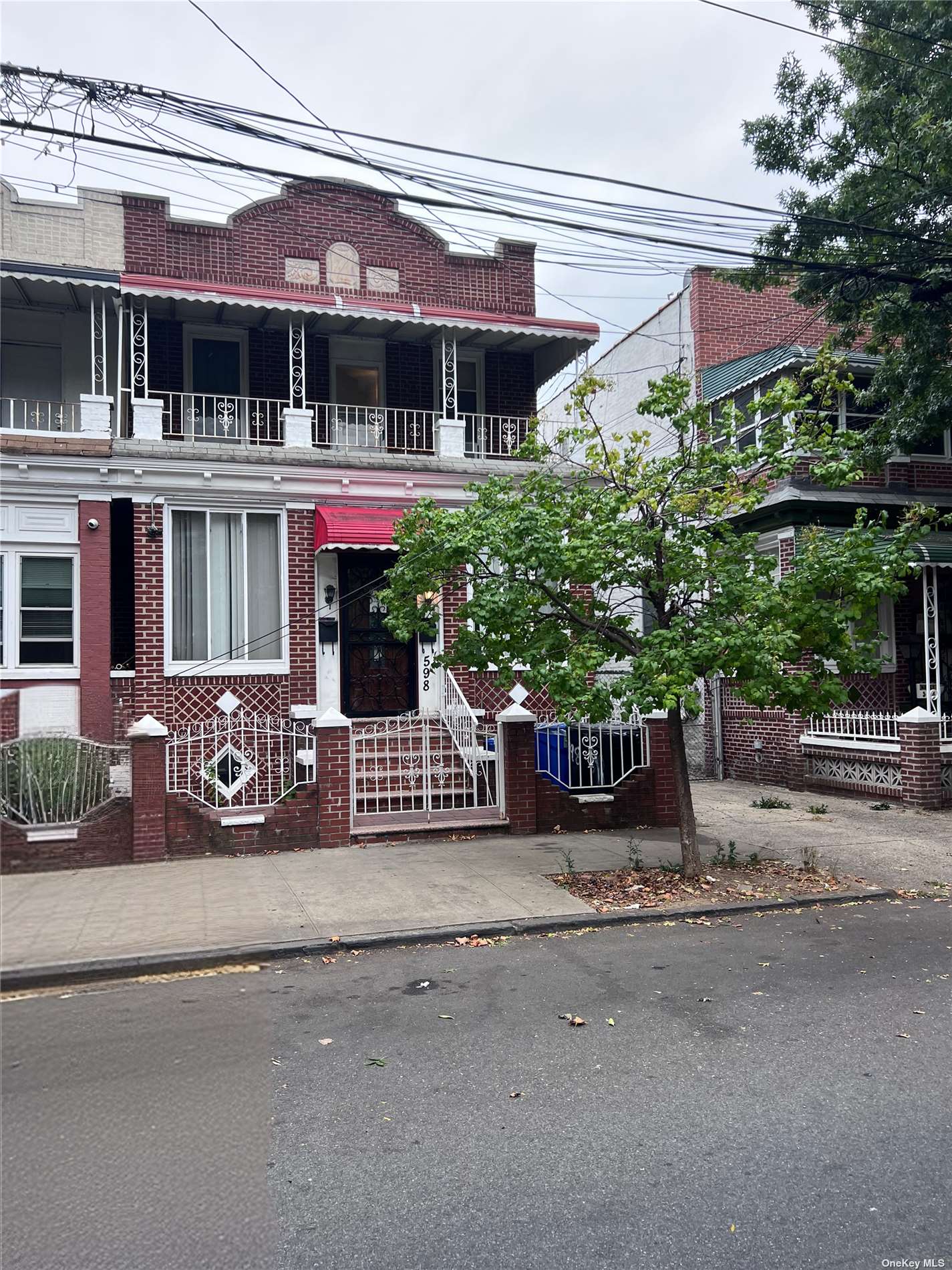 front view of a house with potted plants