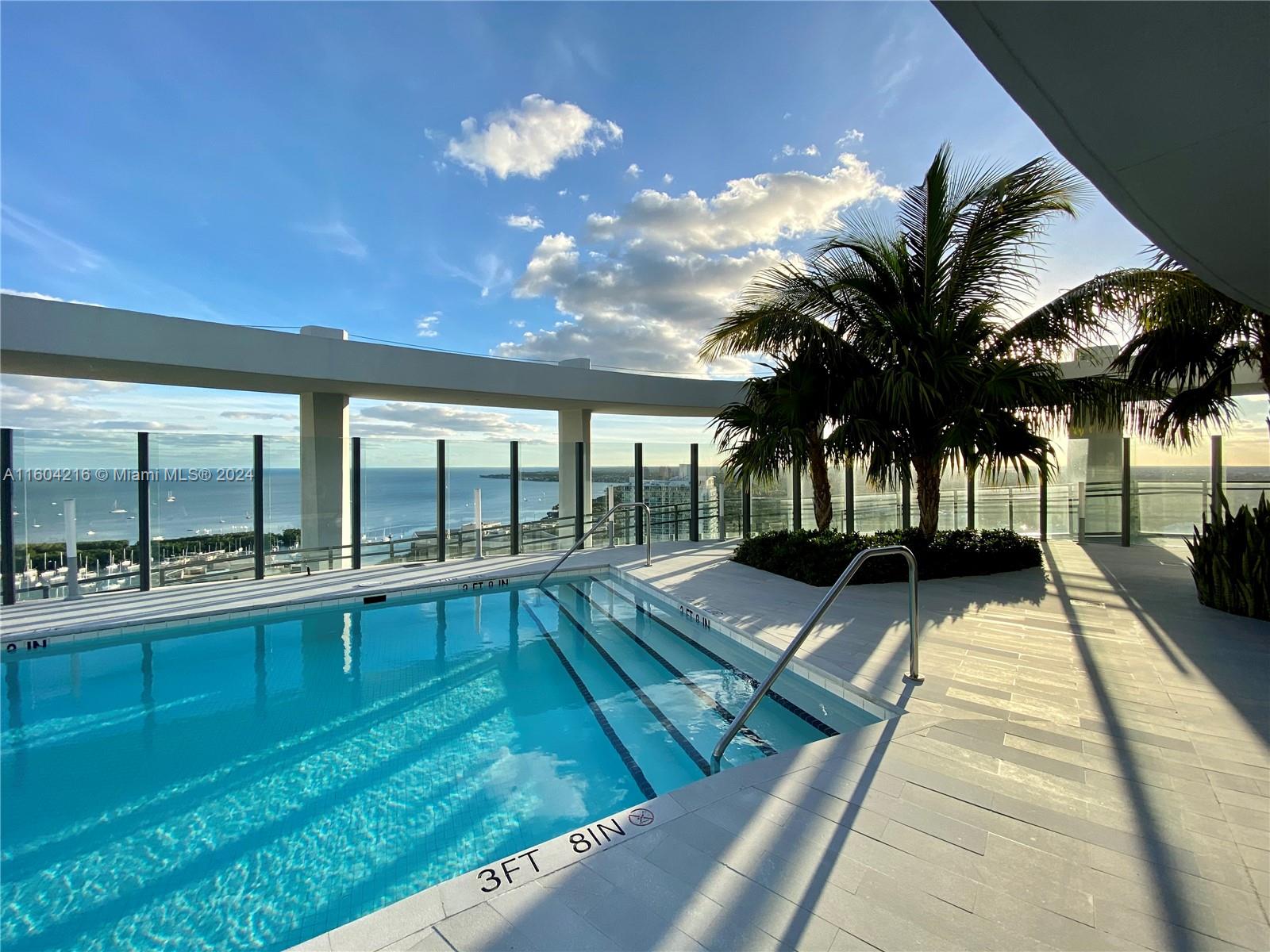 a view of swimming pool with seating area