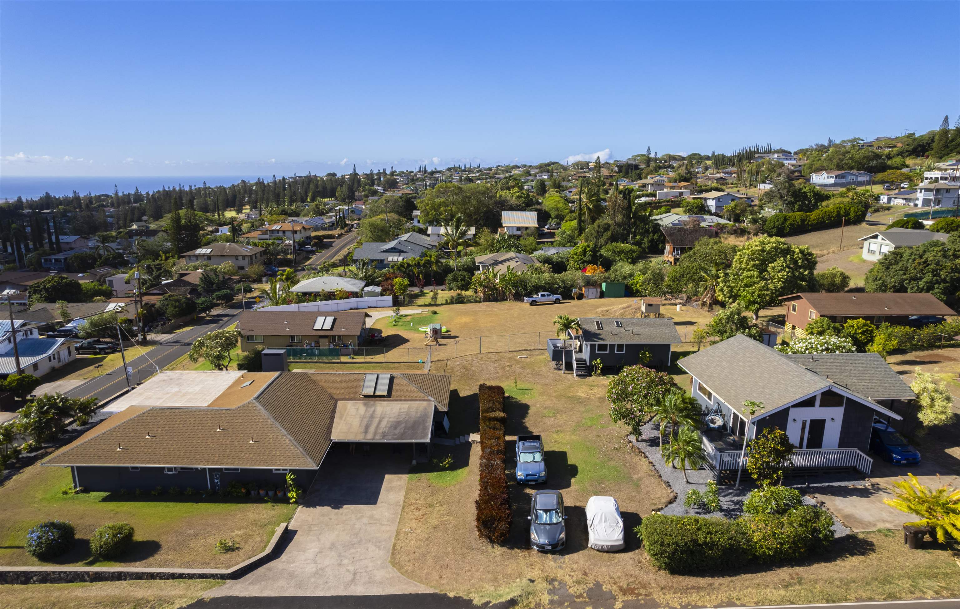 an aerial view of a house with a swimming pool