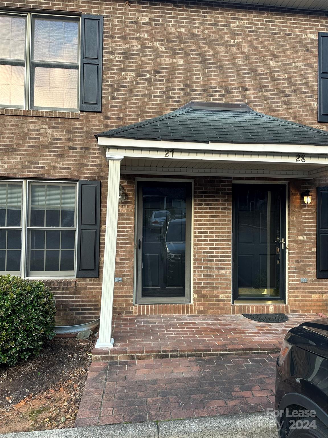 a front view of a house with glass windows