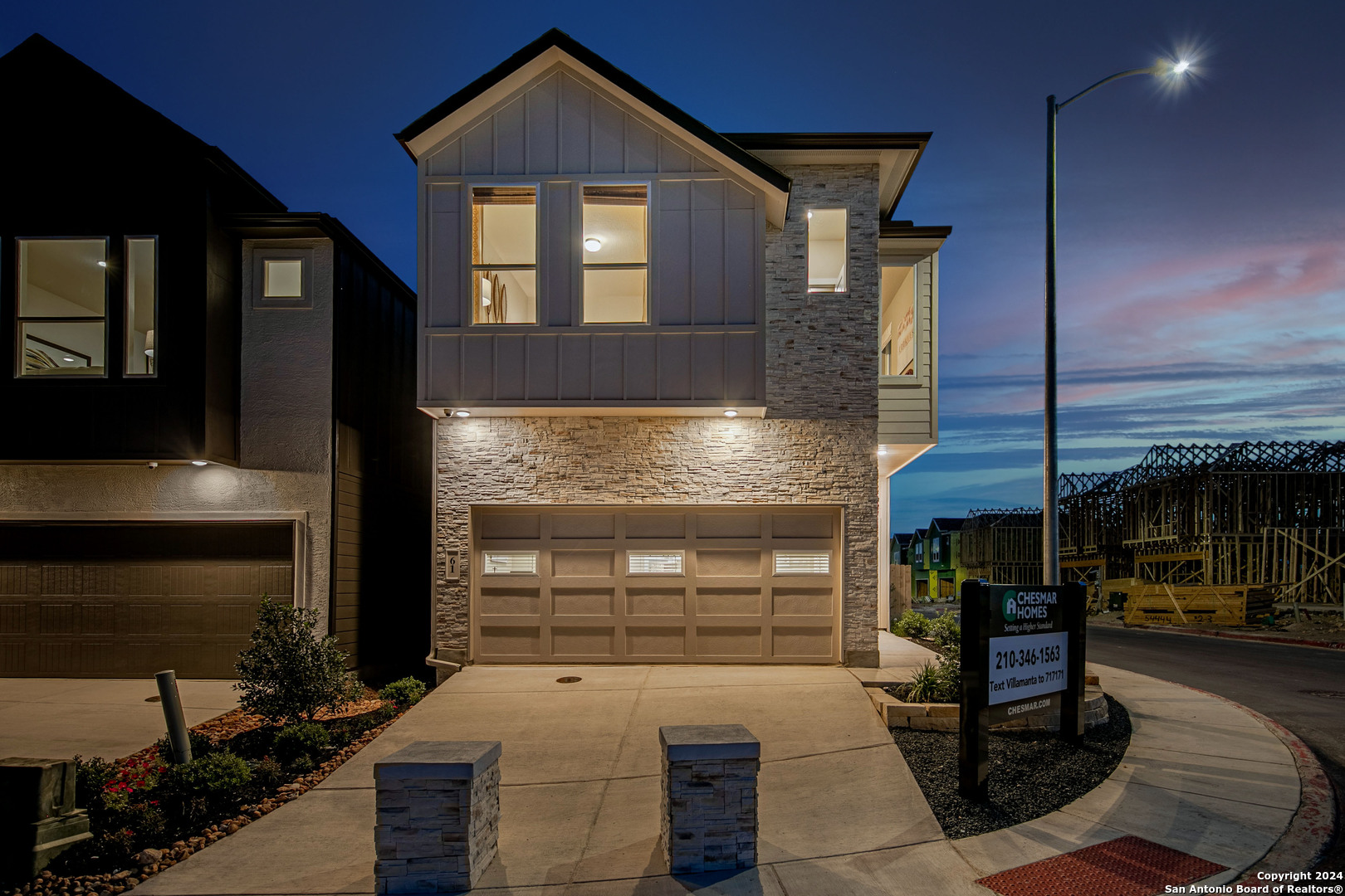 a front view of a house with a garage