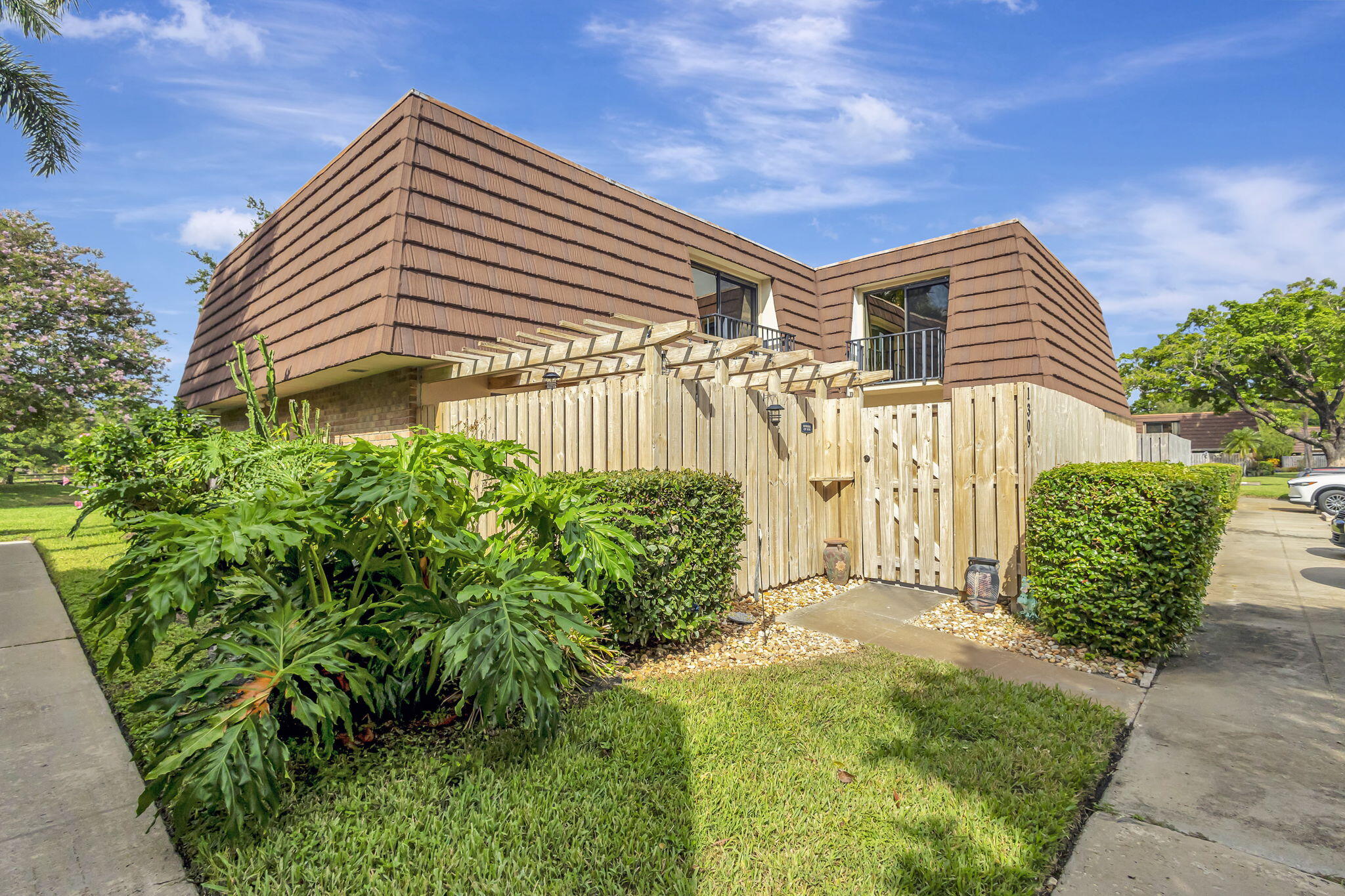 a front view of a house with garden