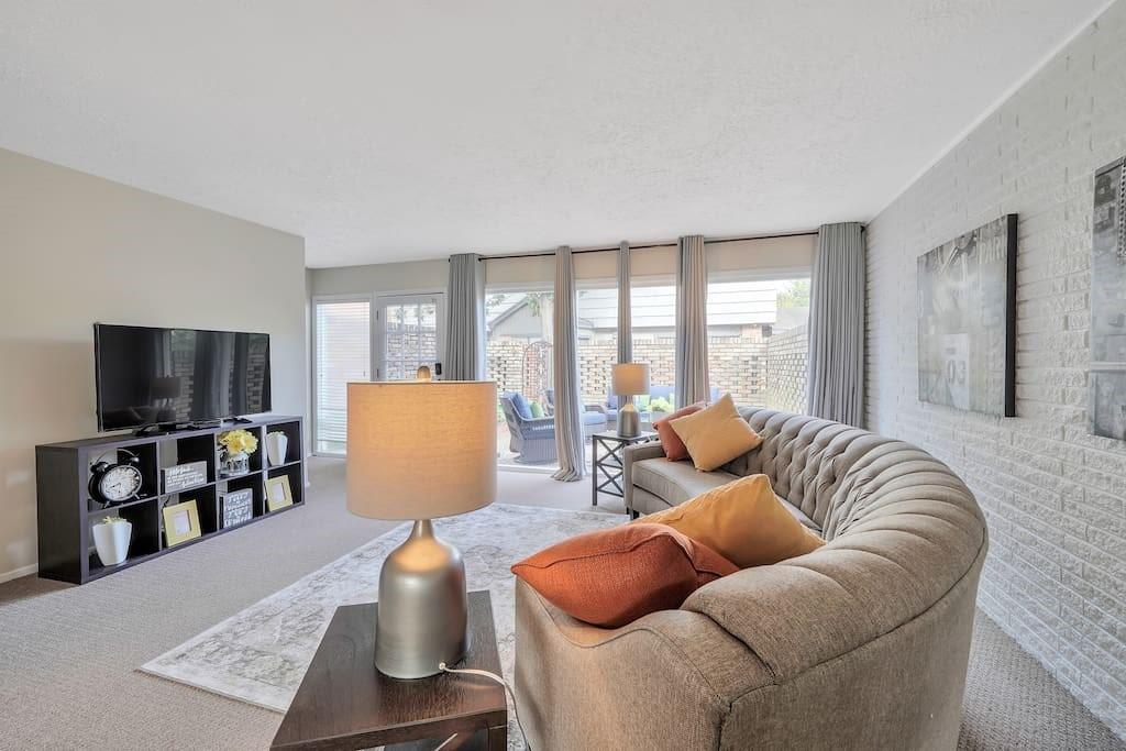 a living room with furniture and a flat screen tv