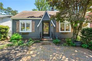 a front view of a house with yard