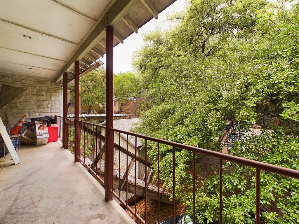 a view of a balcony with many windows