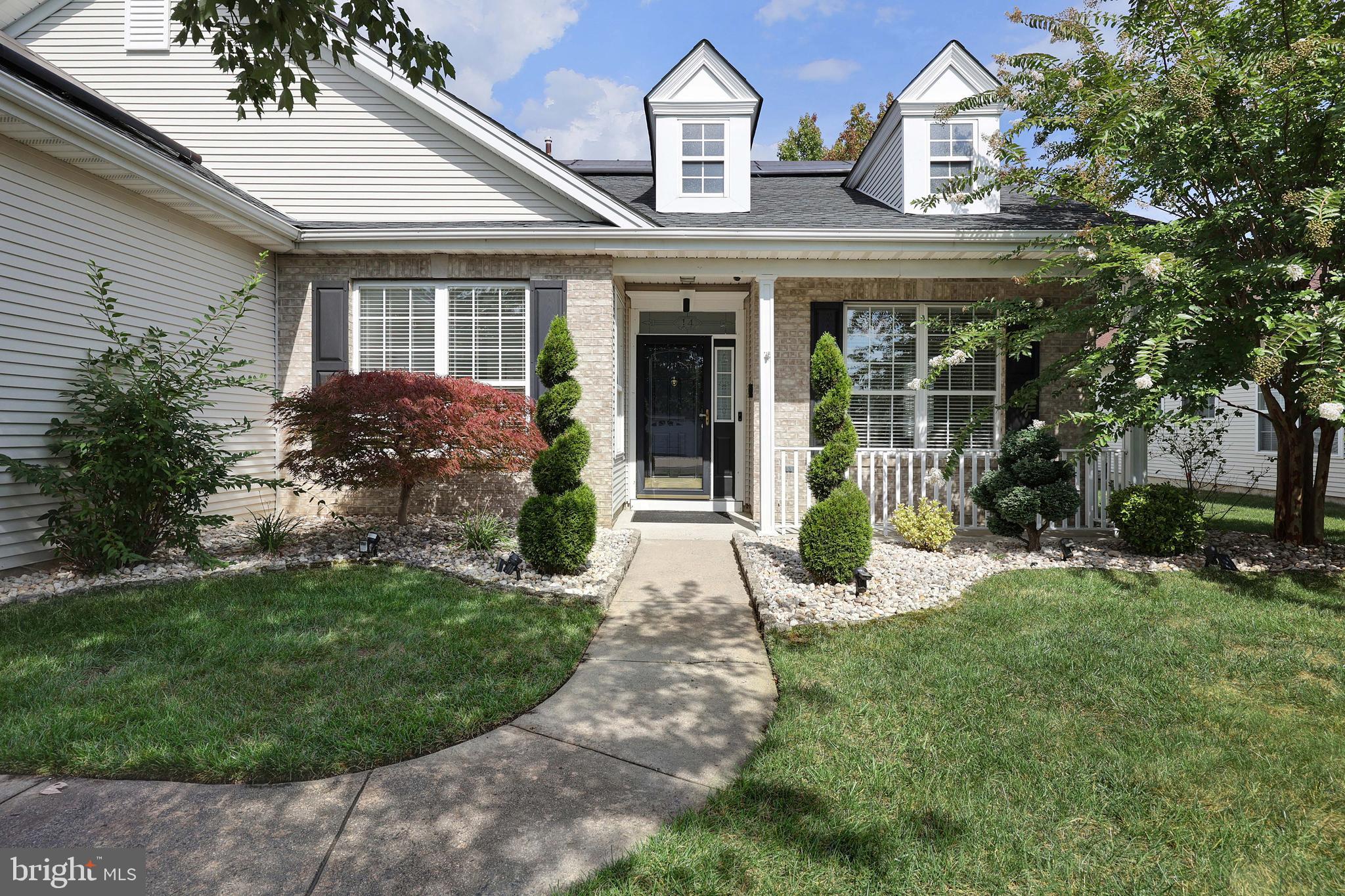 front view of a house with a yard