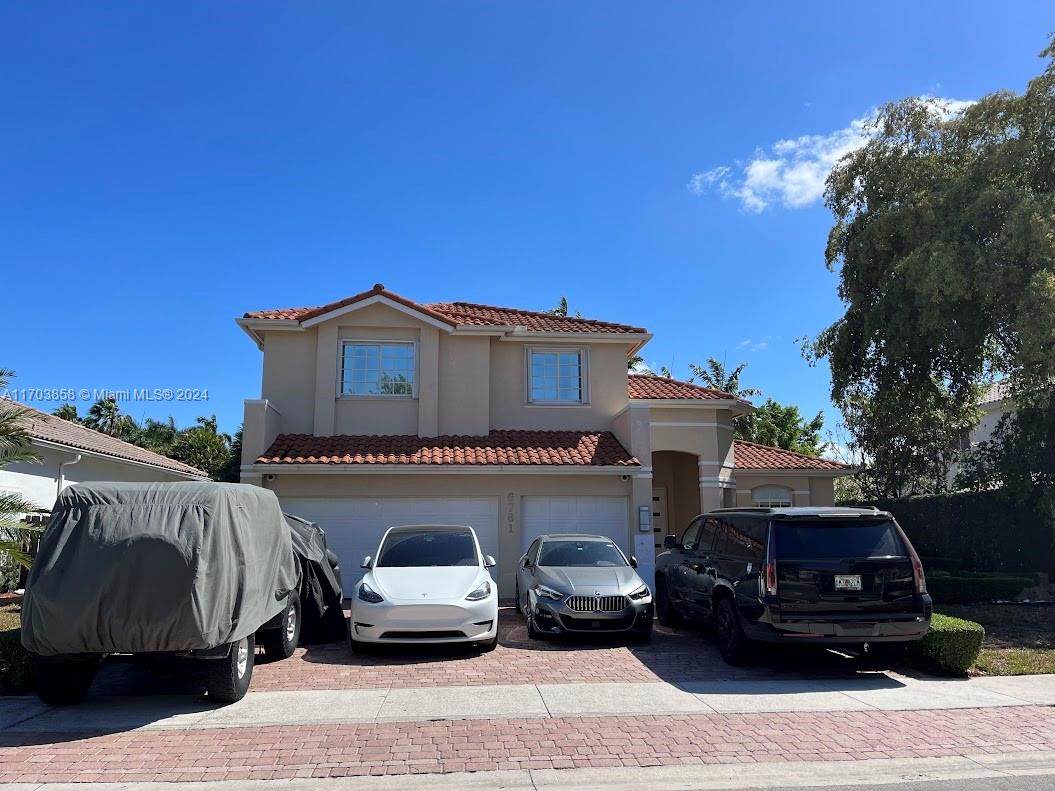 a view of a car parked in front of a house