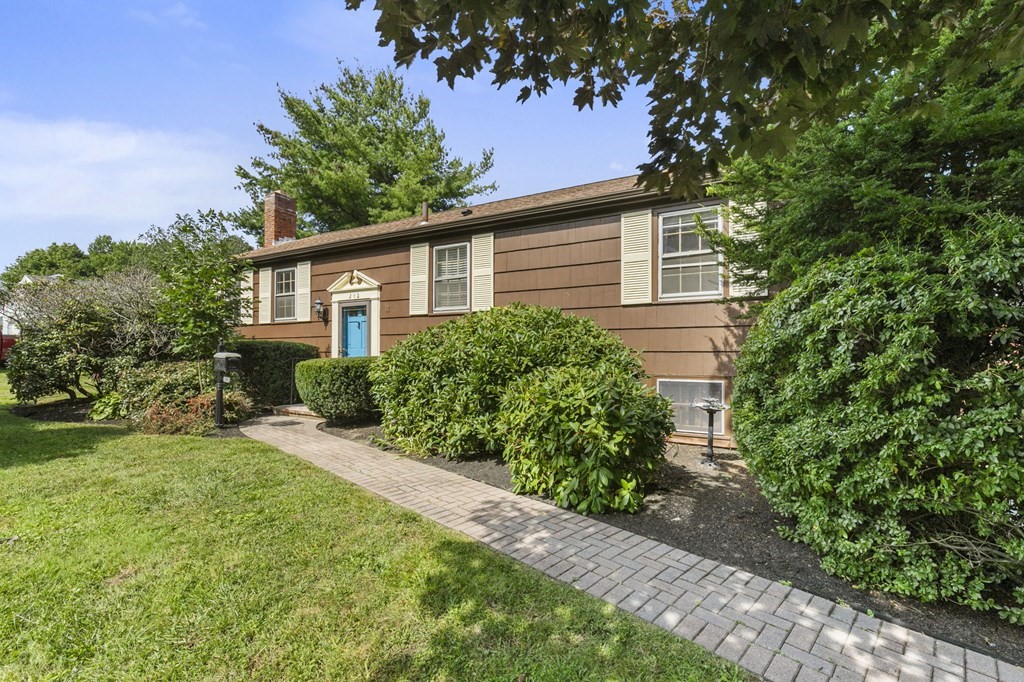 a front view of a house with a yard