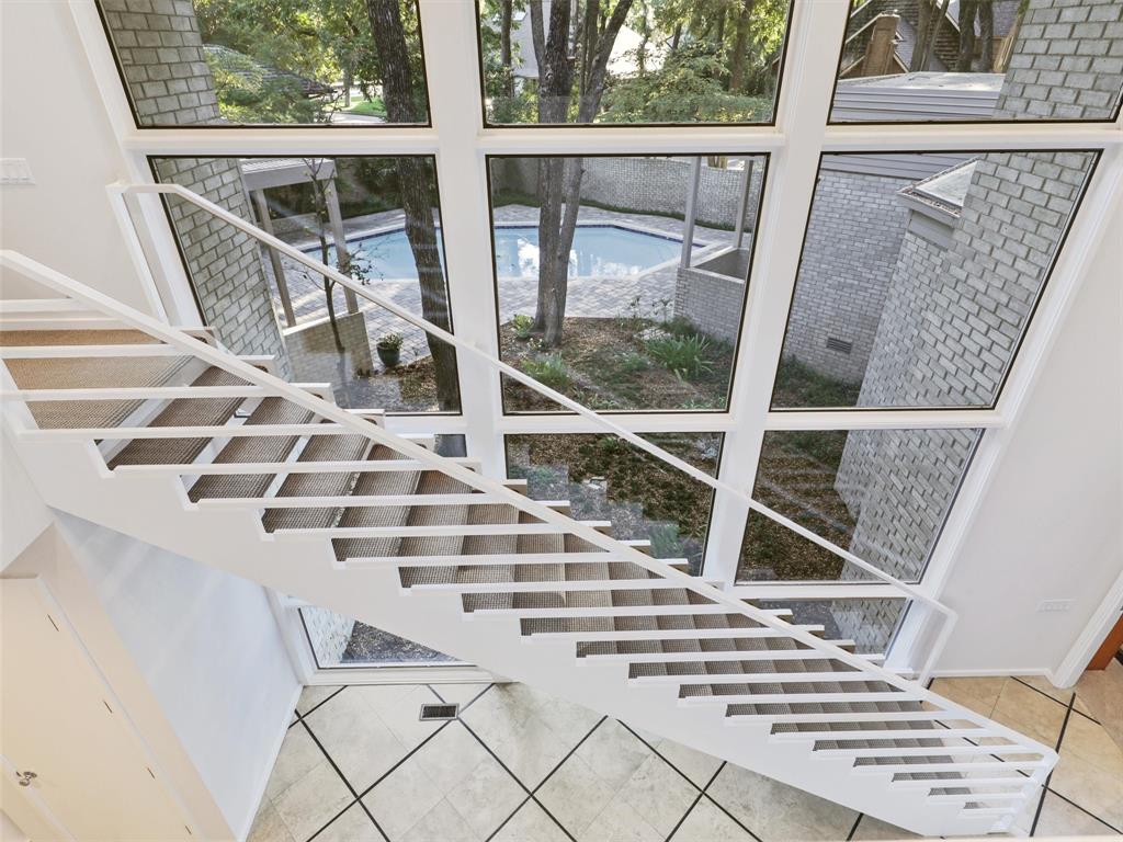 a view of balcony with wooden floor and windows