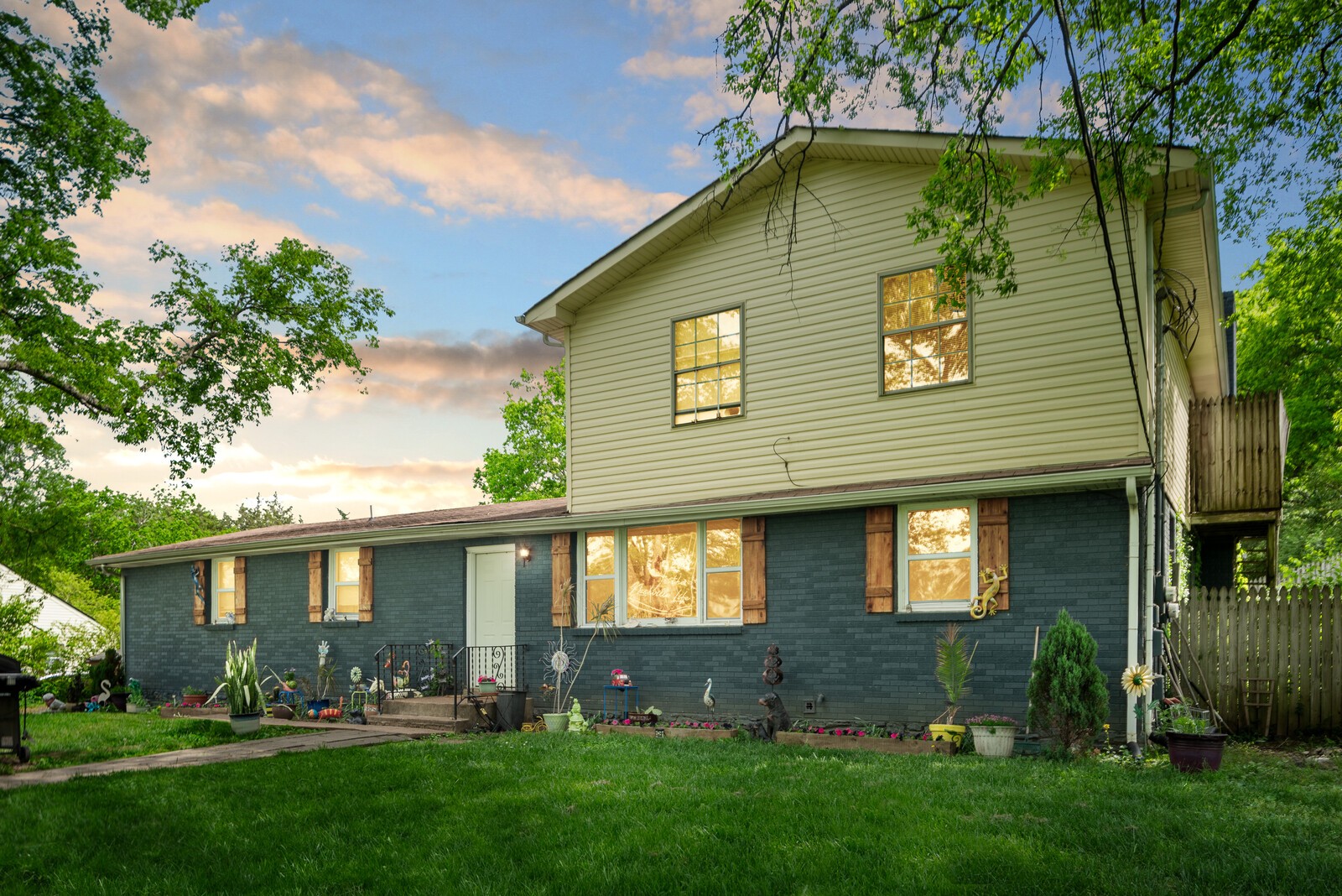 a view of house with a yard