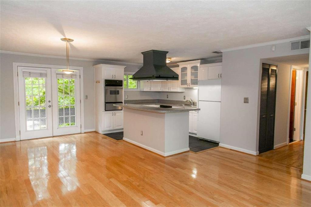 a kitchen with stainless steel appliances granite countertop a stove and a refrigerator