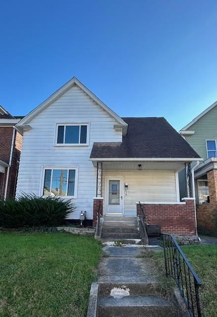 a view of house with yard