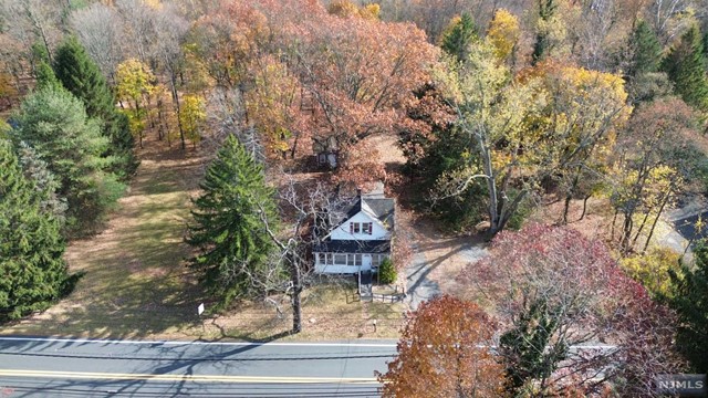 a view of house with yard