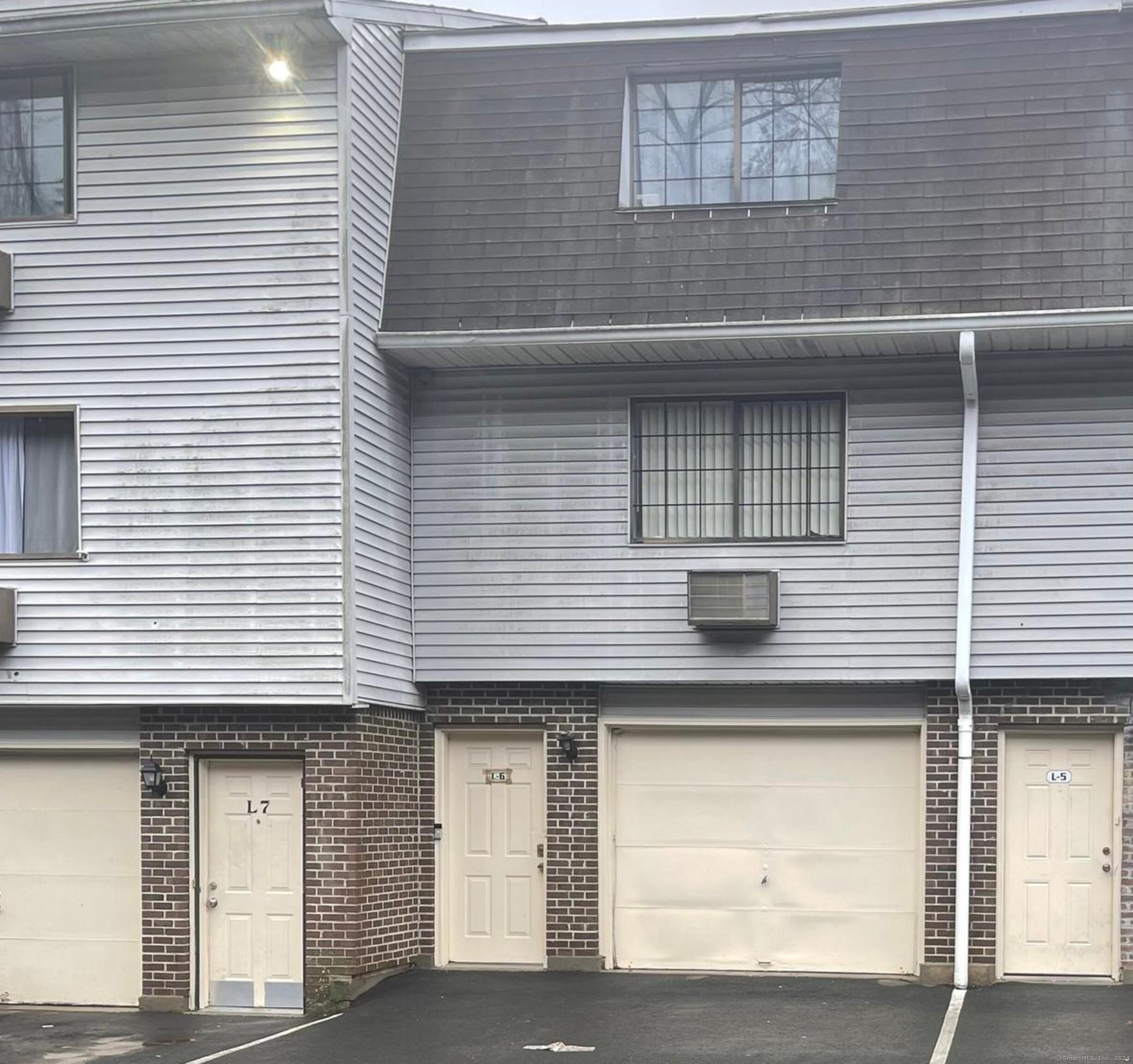 a front view of a house with garage