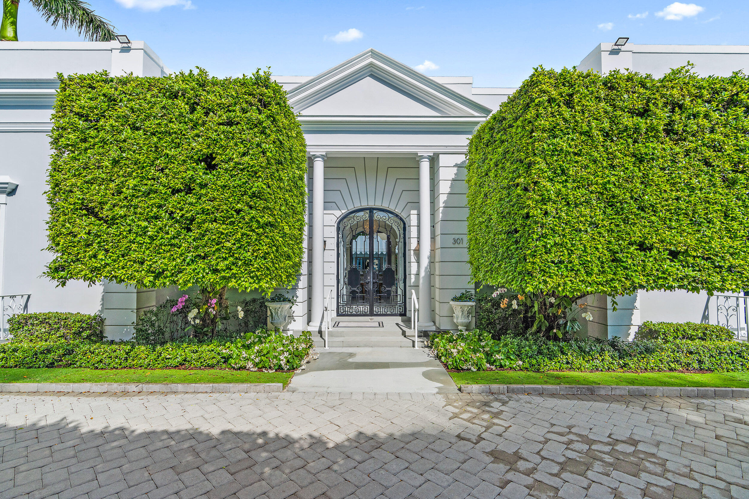 a front view of a house with garden