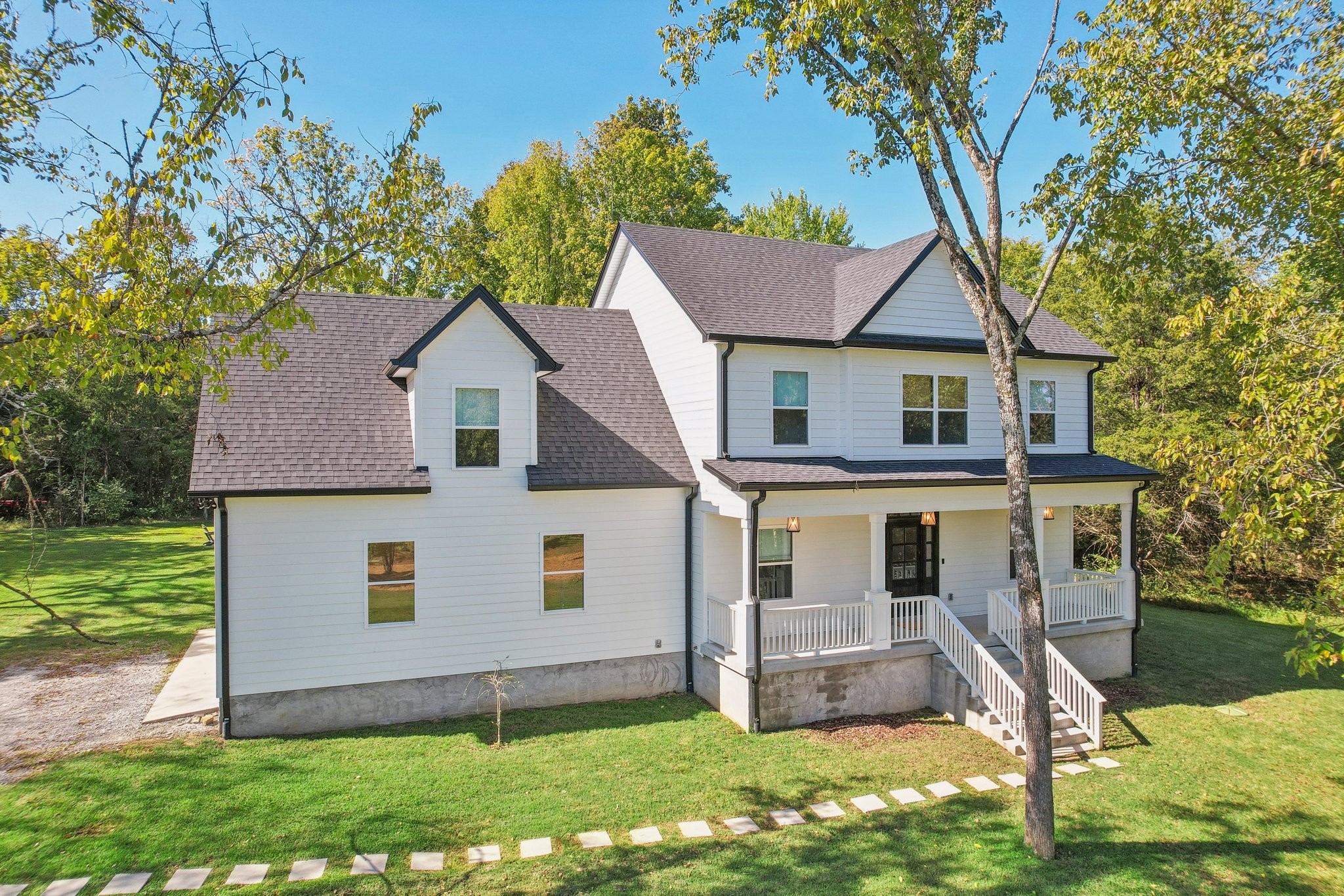 front view of a house with a yard