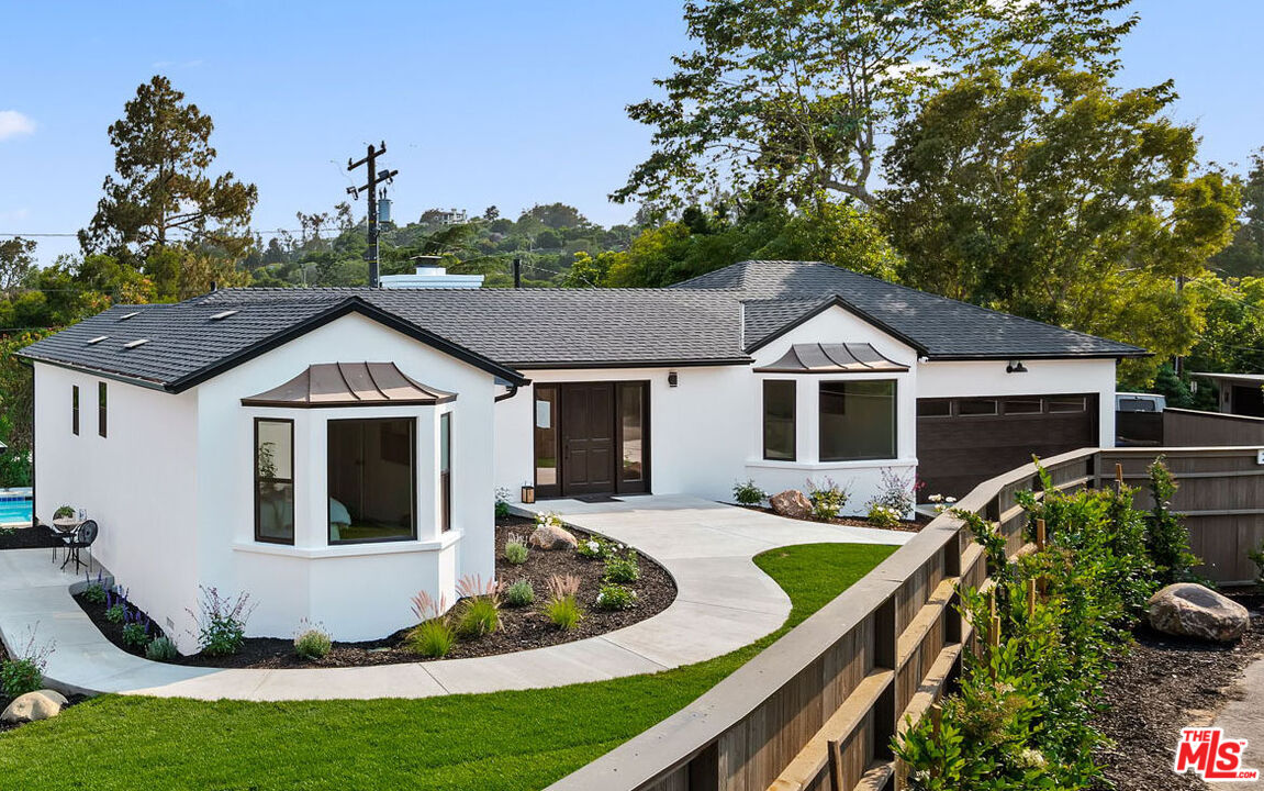 a view of house with yard outdoor seating and entertaining space