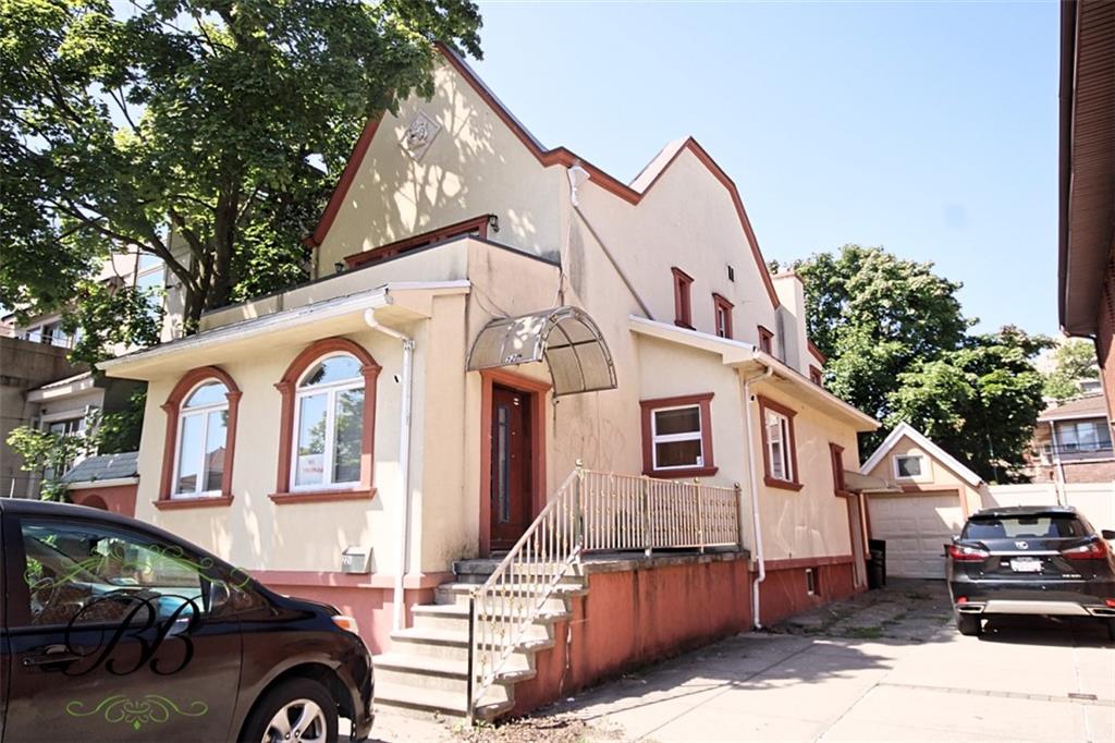 a front view of a house with parking