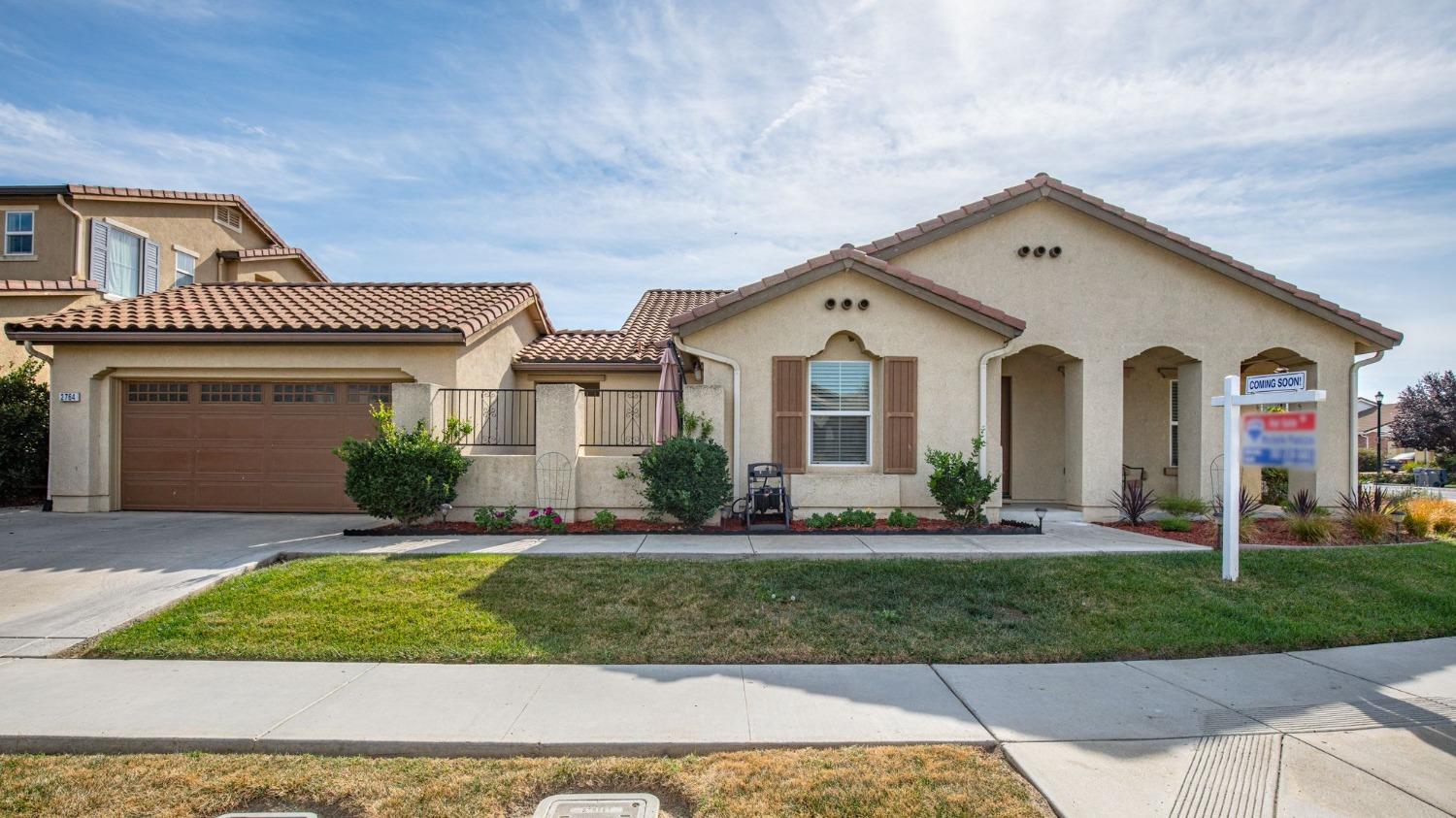 a front view of a house with a yard