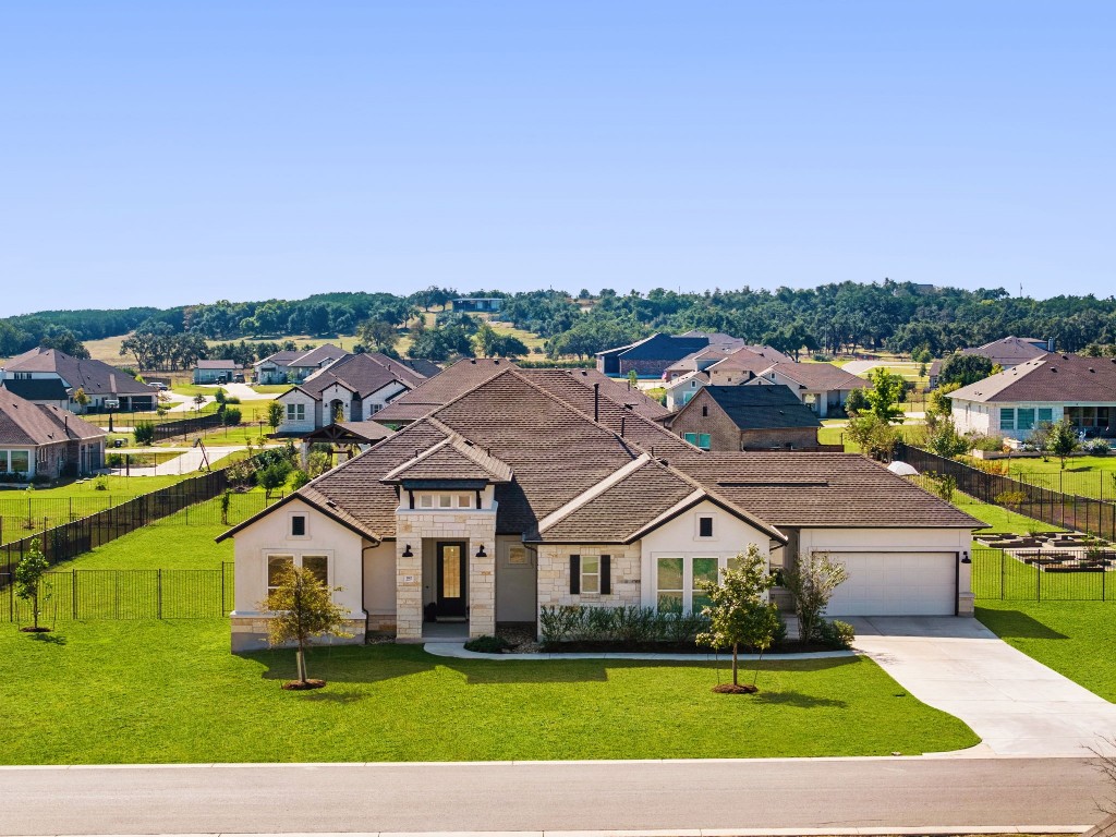 a aerial view of a house with a big yard