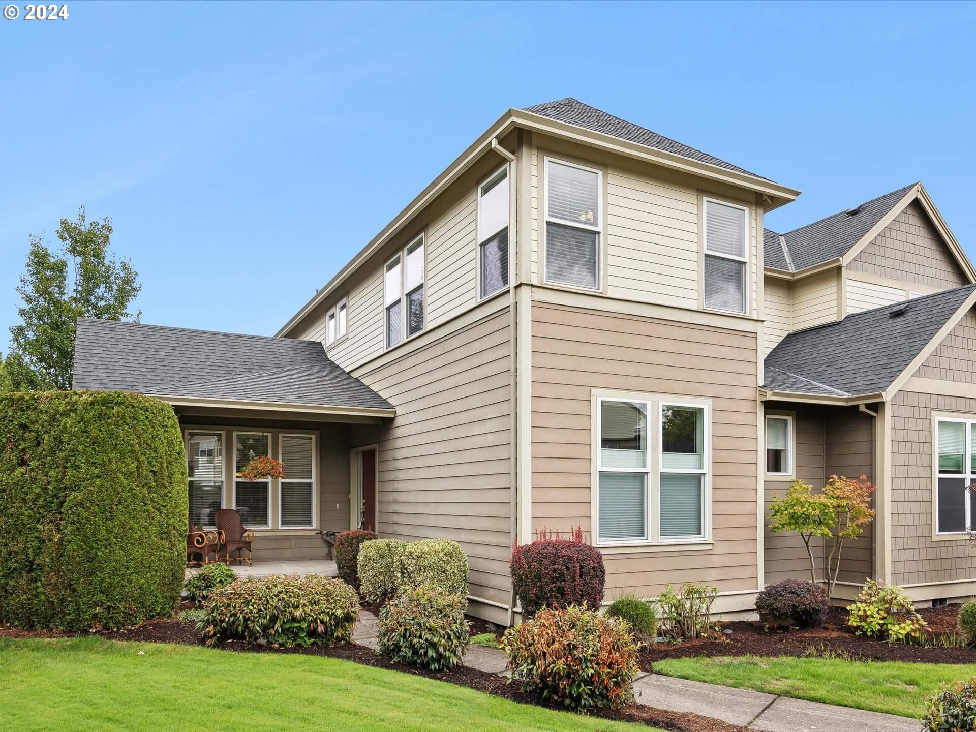 a front view of a house with garden