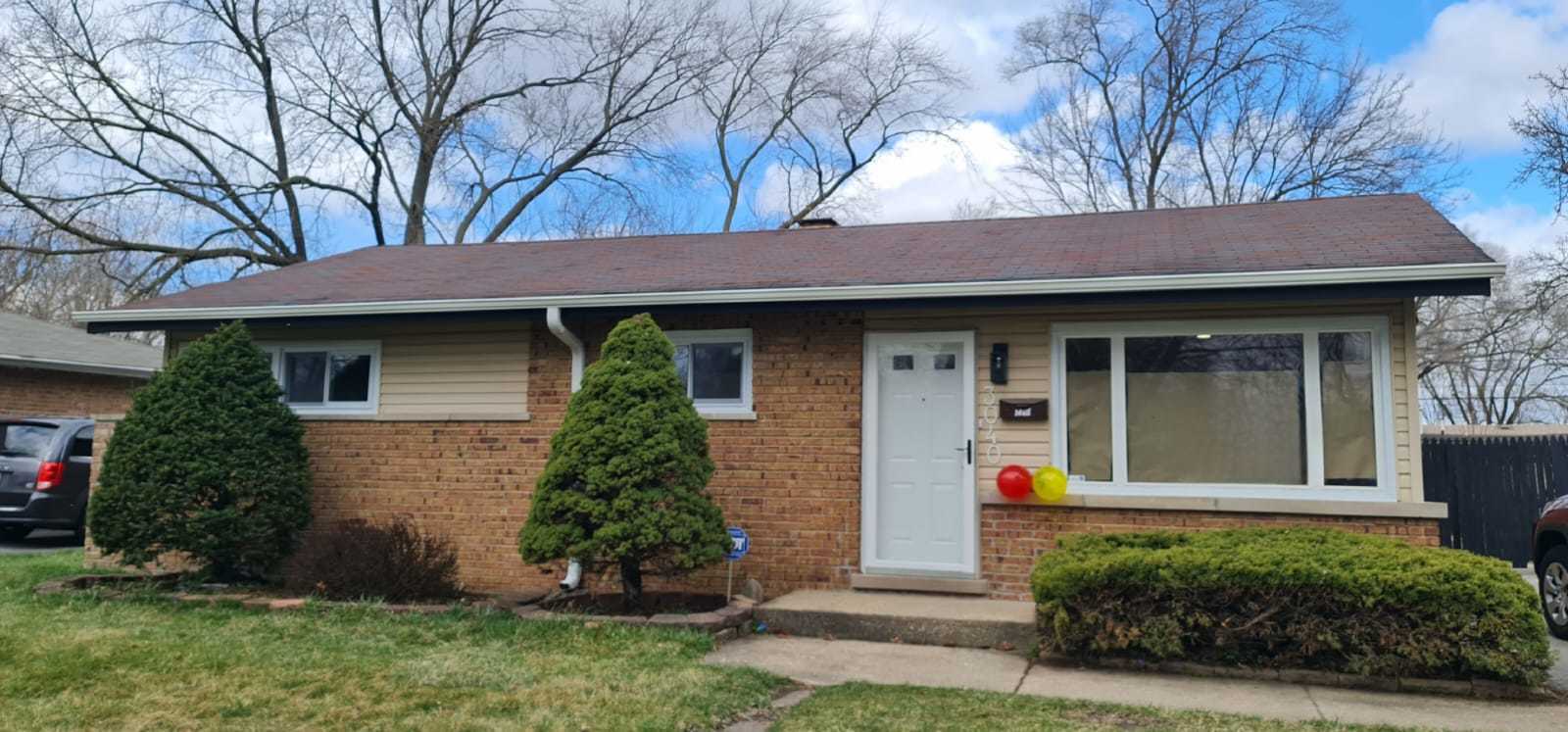 front view of a house with a yard