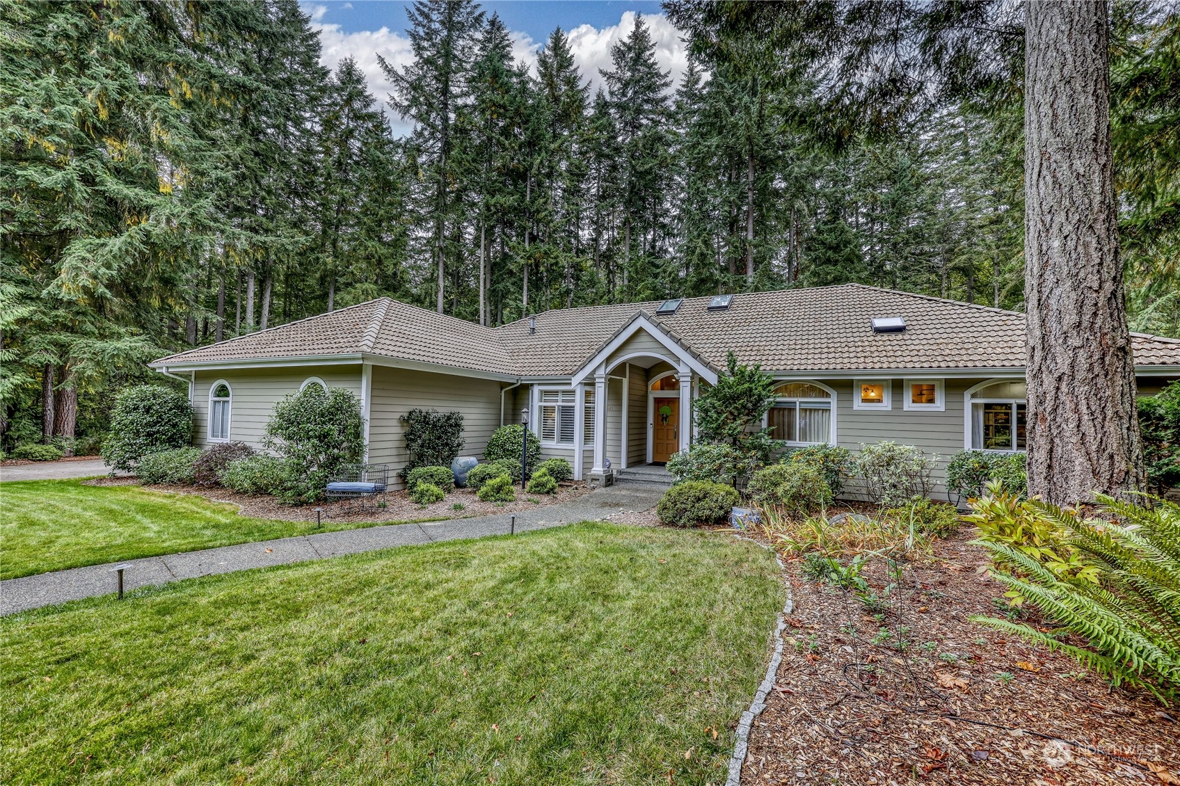 a front view of a house with a yard