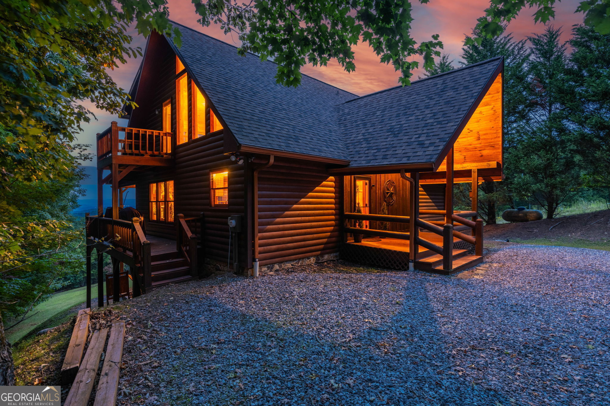 a backyard of a house with barbeque oven and trees