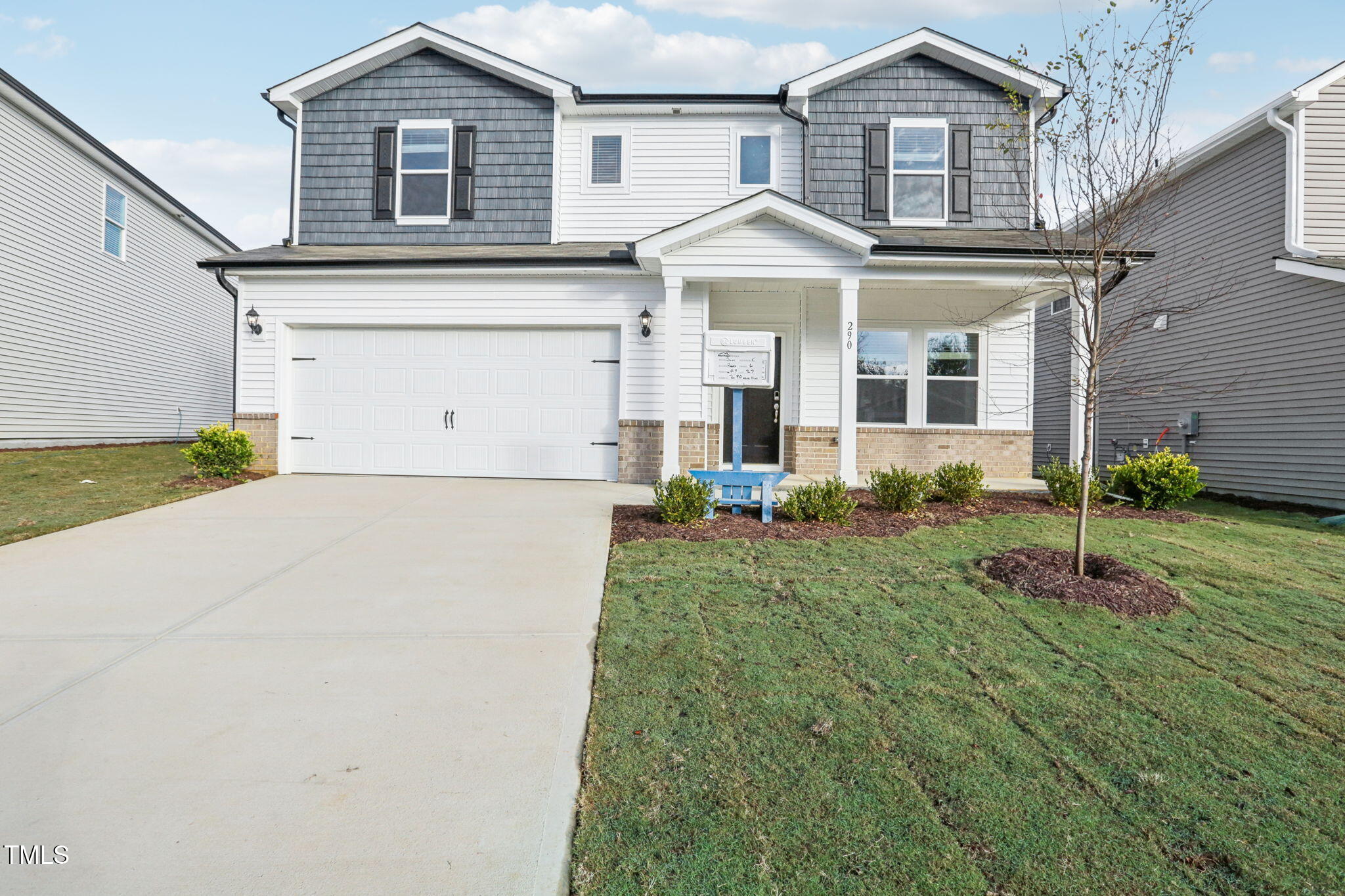 front view of a house with a yard