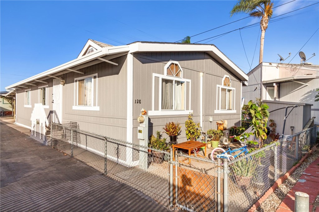 a front view of a house with outdoor seating