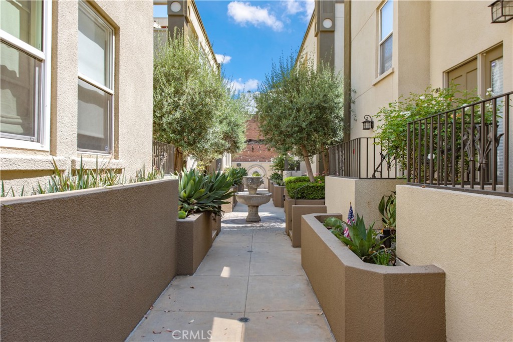 a view of a patio with couches and potted plants