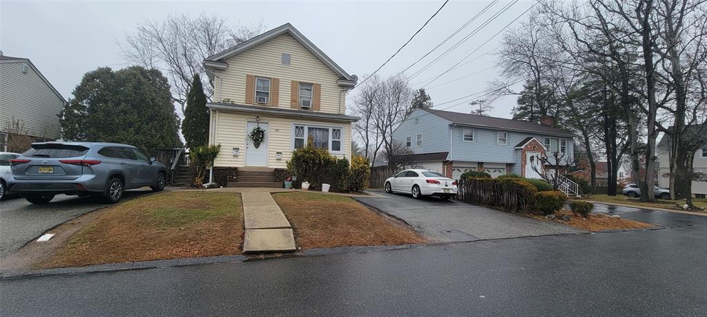 a cars parked in front of a house