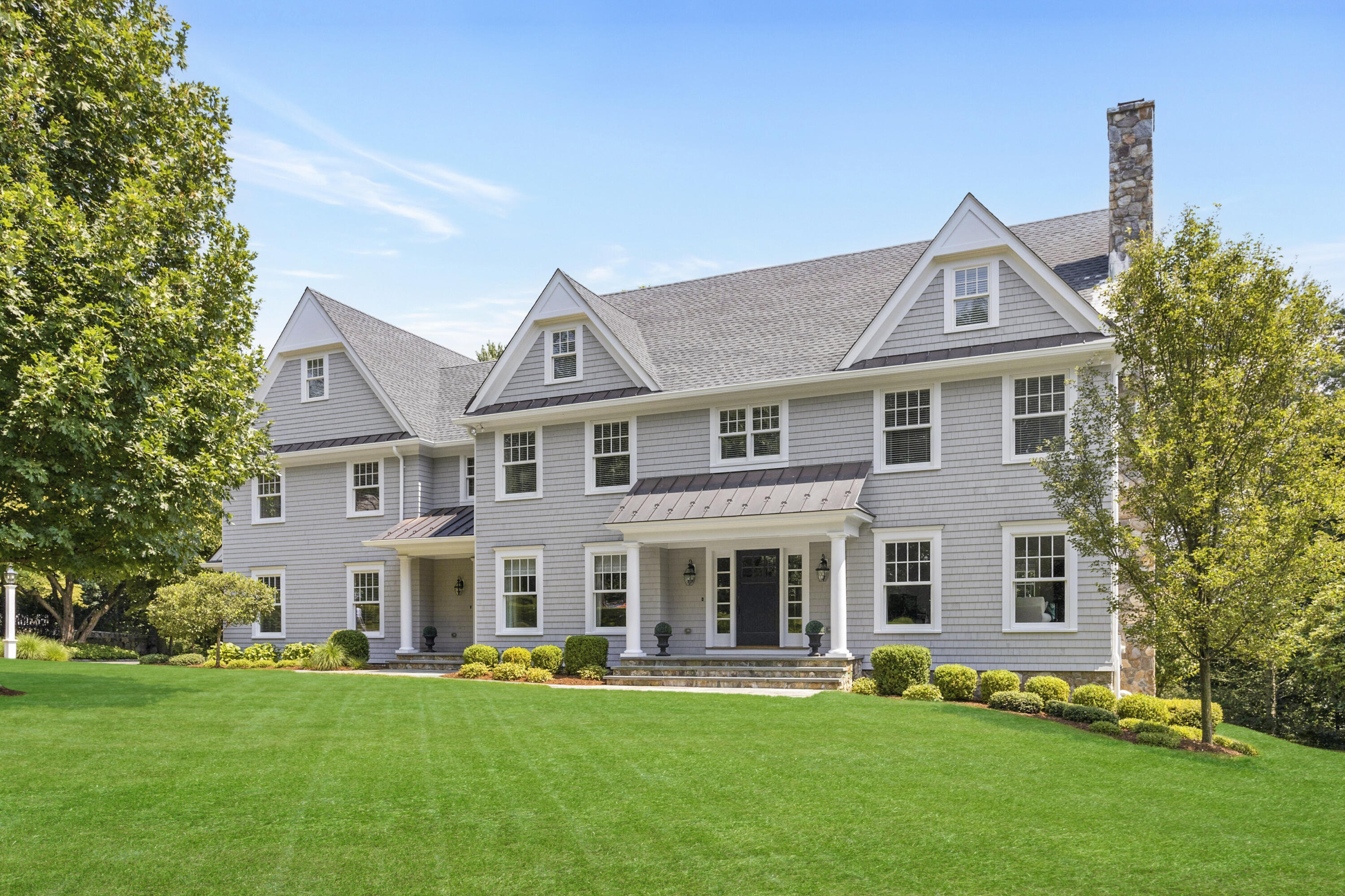 front view of a house with a yard