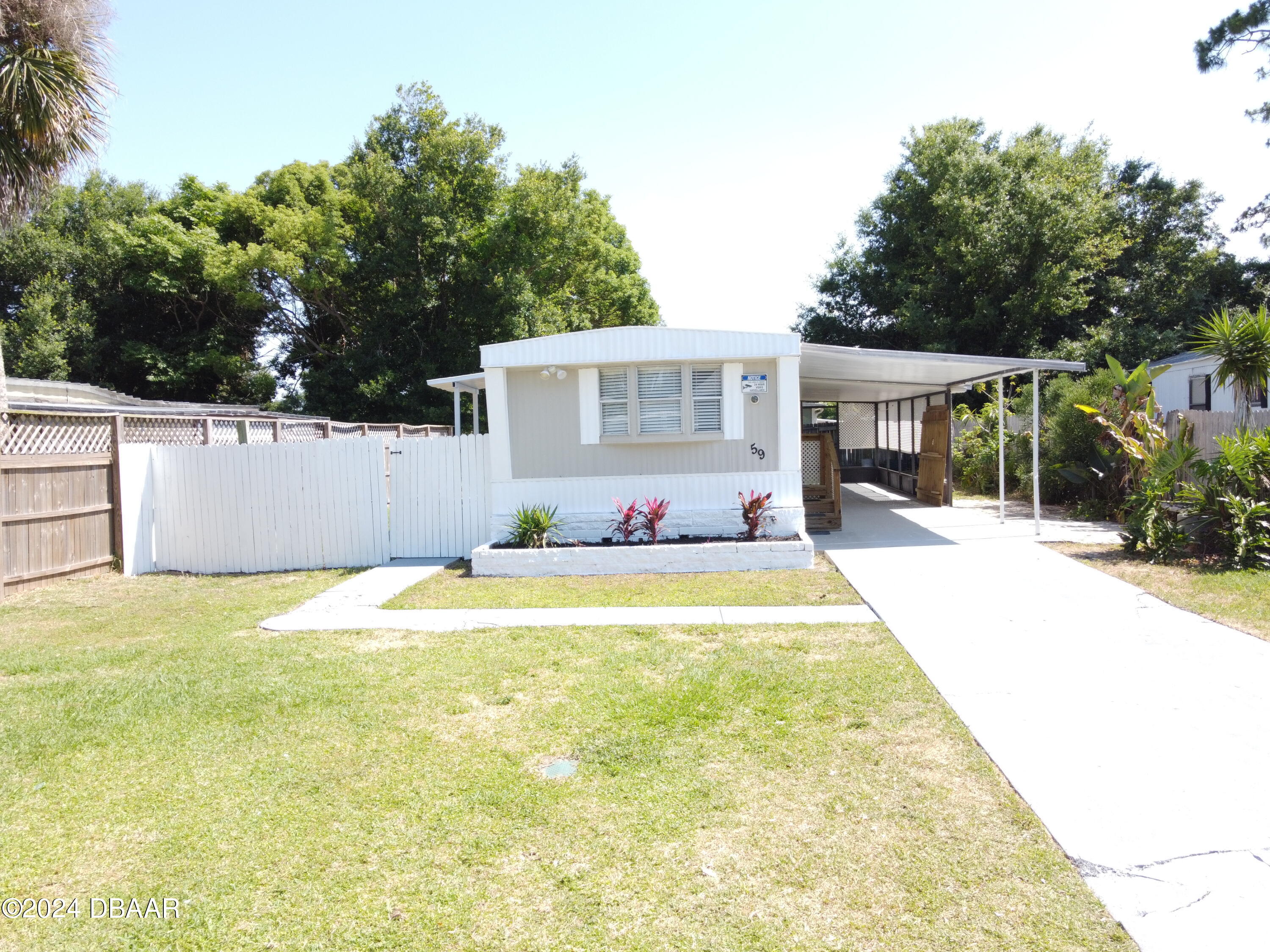 a swimming pool with outdoor seating and yard