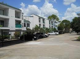 a view of a street with a building in the background