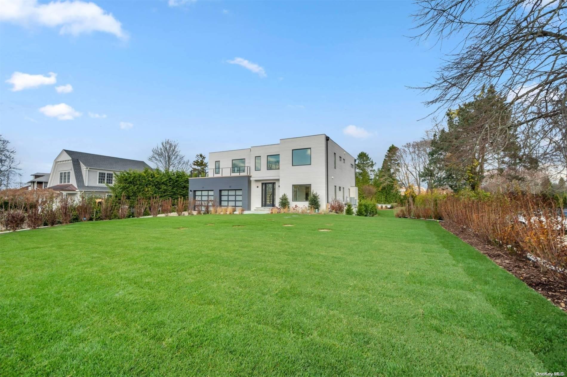 a view of a big yard with a house in the background