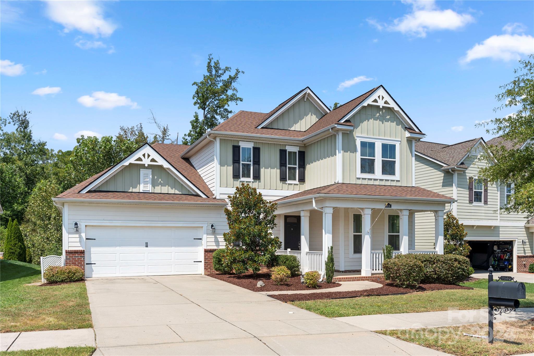 a front view of a house with garden