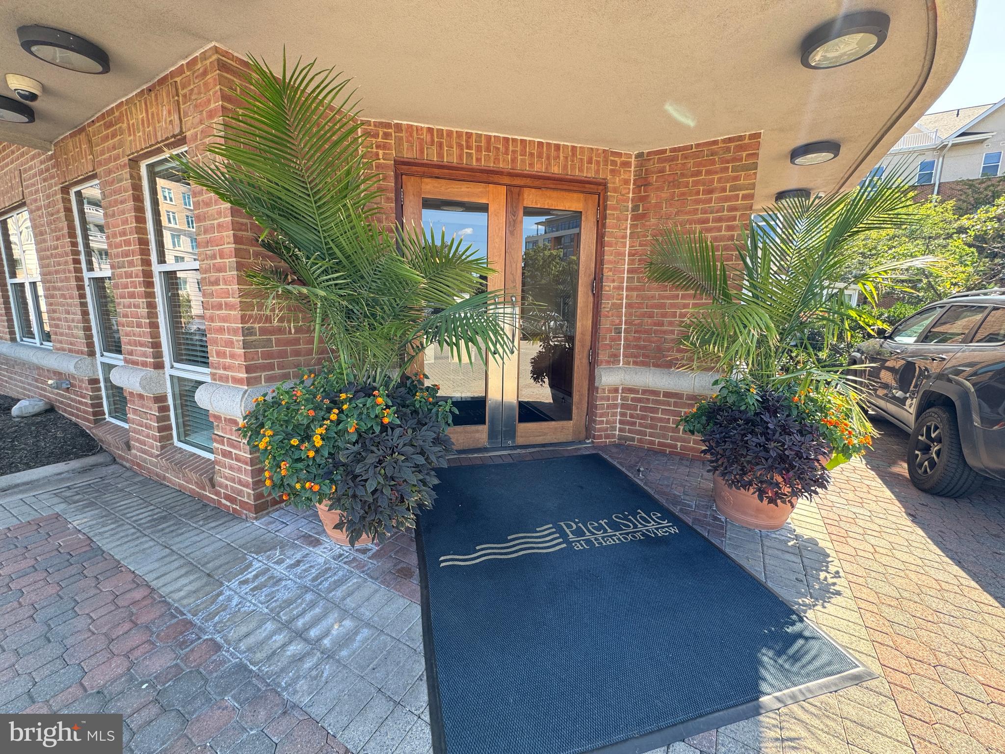 a view of a house with a yard and sitting area