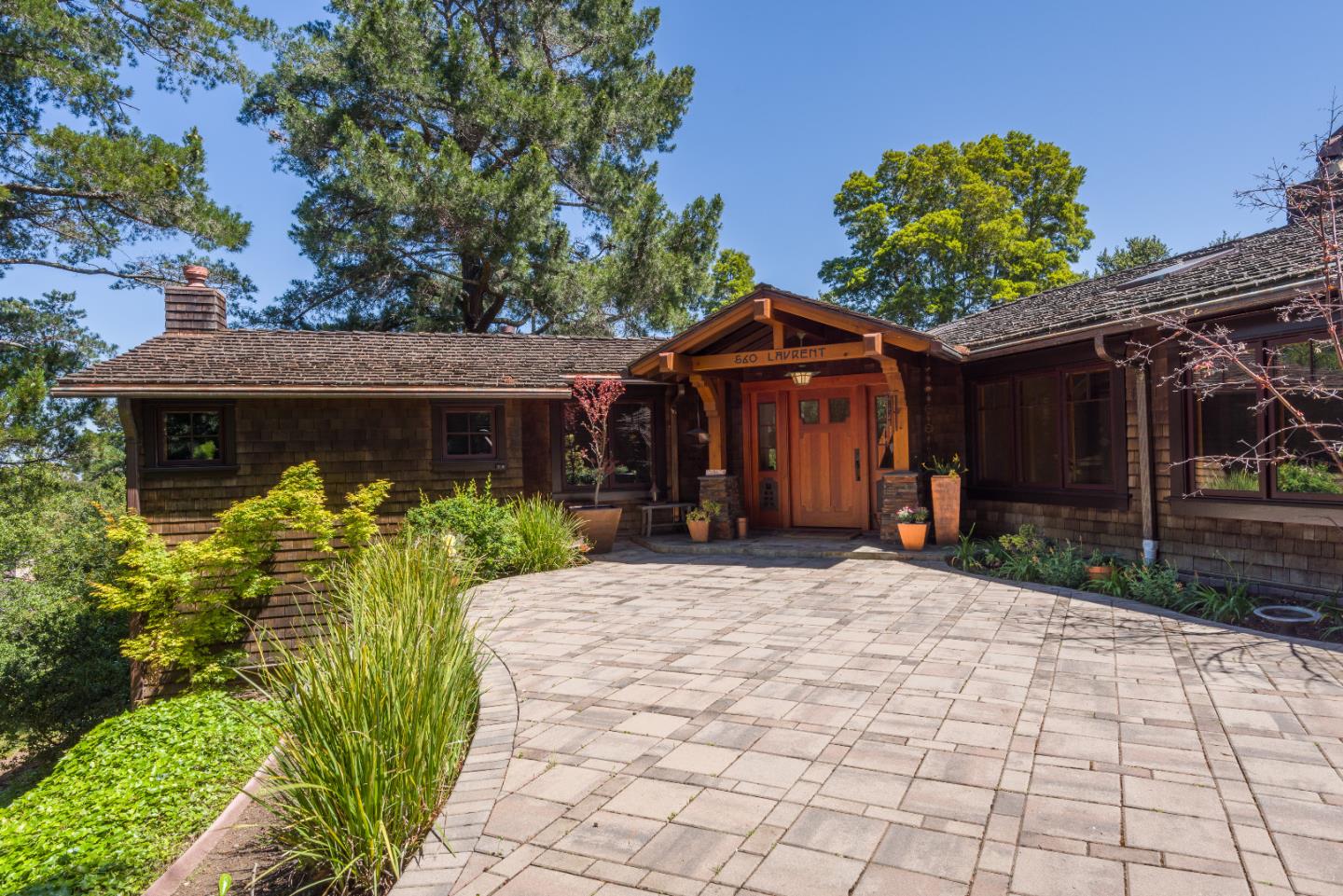 a front view of a house with garden