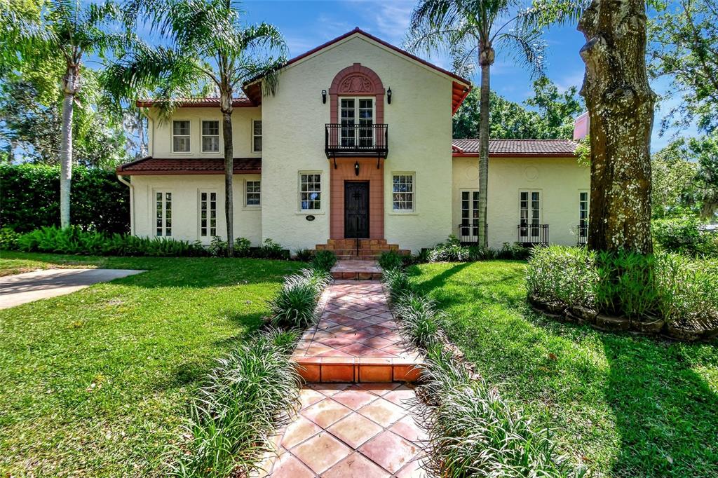 a front view of a house with garden