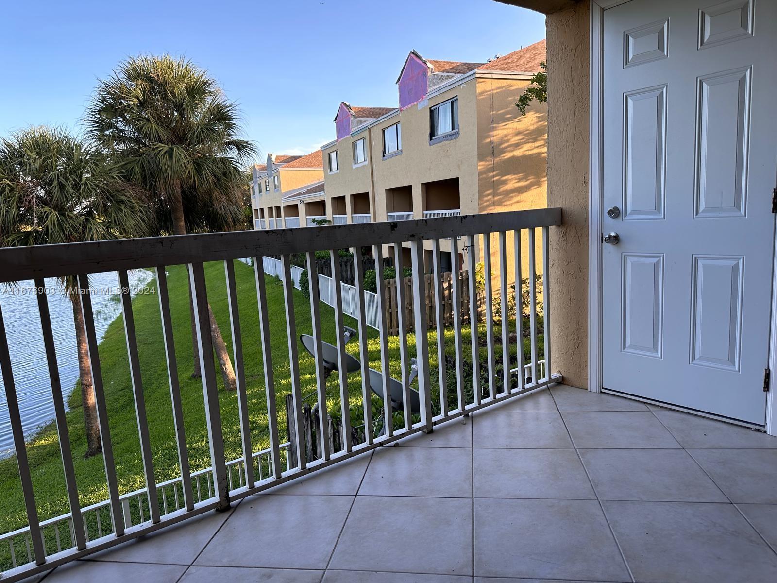 a view of a balcony with an outdoor space