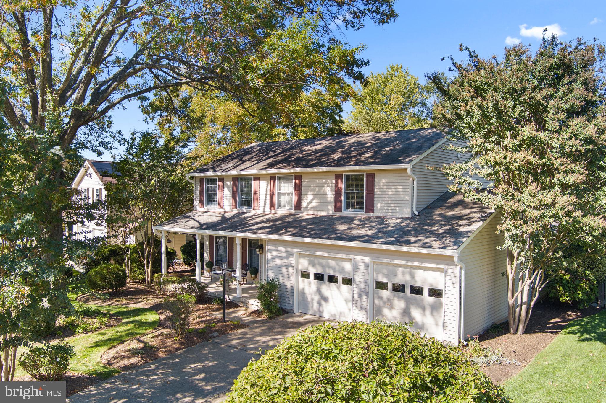 a front view of a house with a yard tree s