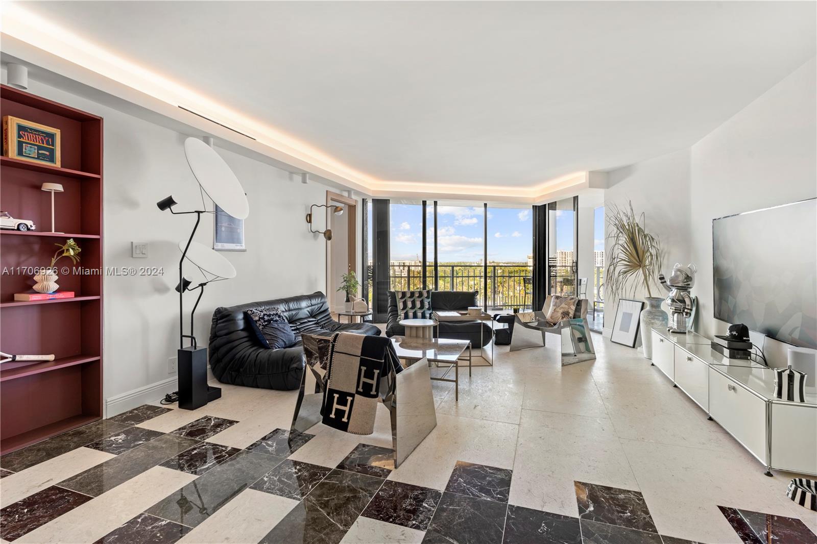 a living room with furniture large window and flat screen tv