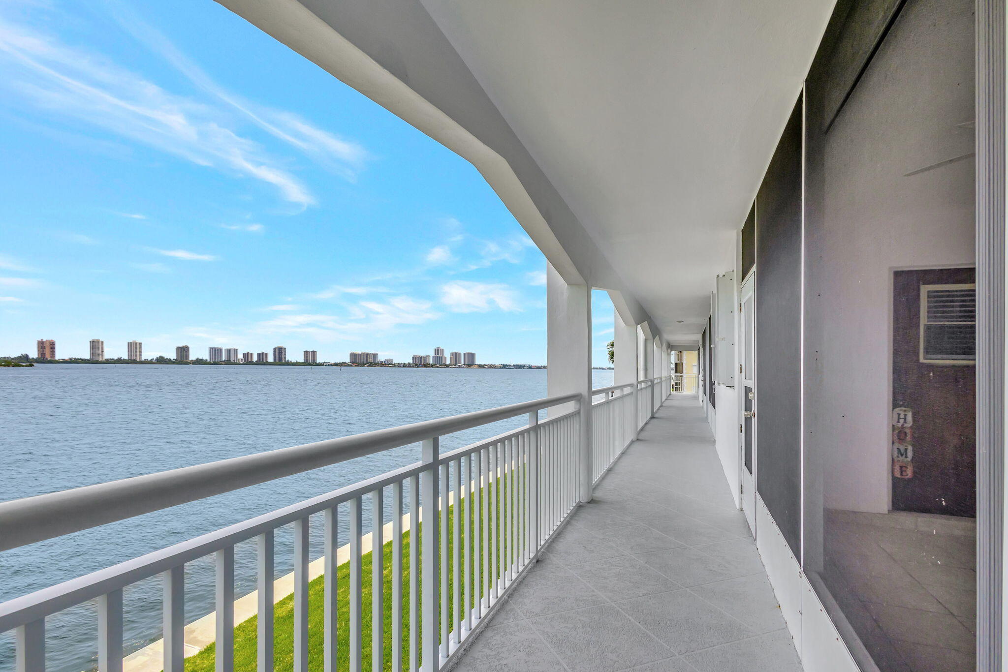 a view of balcony with city and ocean view