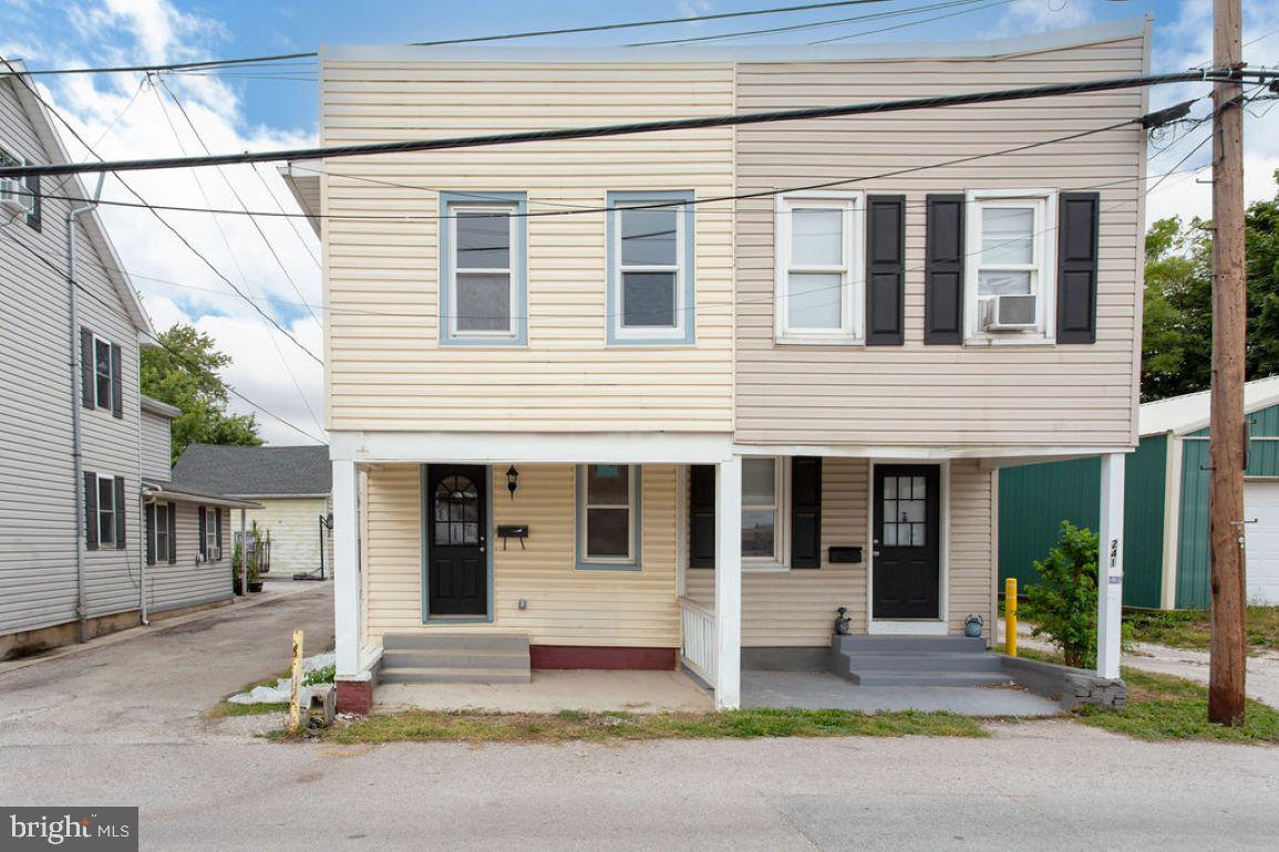 a front view of a house with a garage