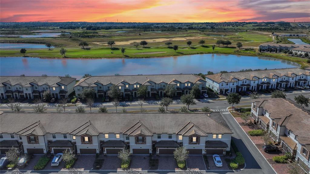 an aerial view of a house with a lake view